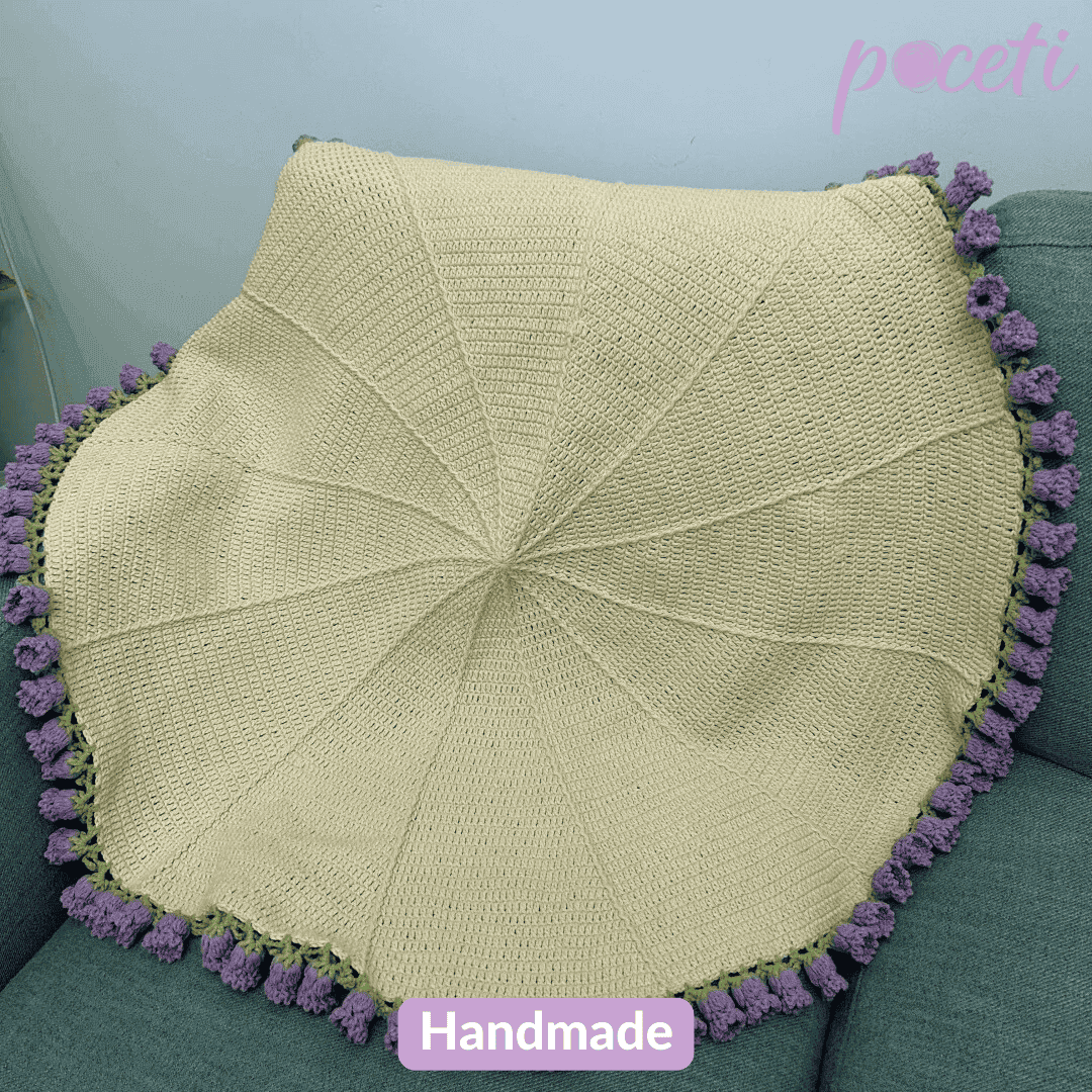 Handmade lily of the valley crochet flower bouquet blanket featuring soft floral patterns and cozy pastel yarns