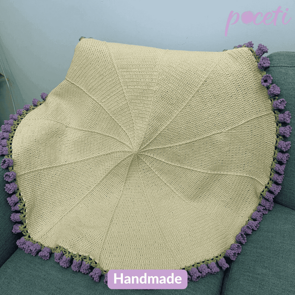 Handmade lily of the valley crochet flower bouquet blanket featuring soft floral patterns and cozy pastel yarns