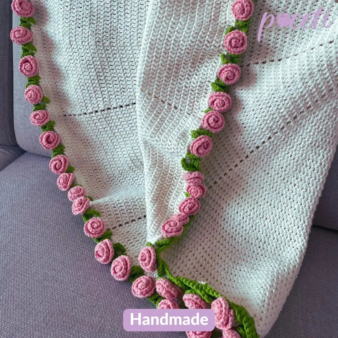 Handmade pink rose crochet flower bouquet blanket with soft floral patterns, perfect for cozy gifting and home décor