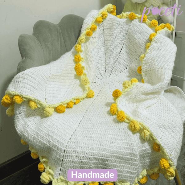 Handmade daisy crochet flower bouquet blanket with soft floral patterns and cozy pastel tones