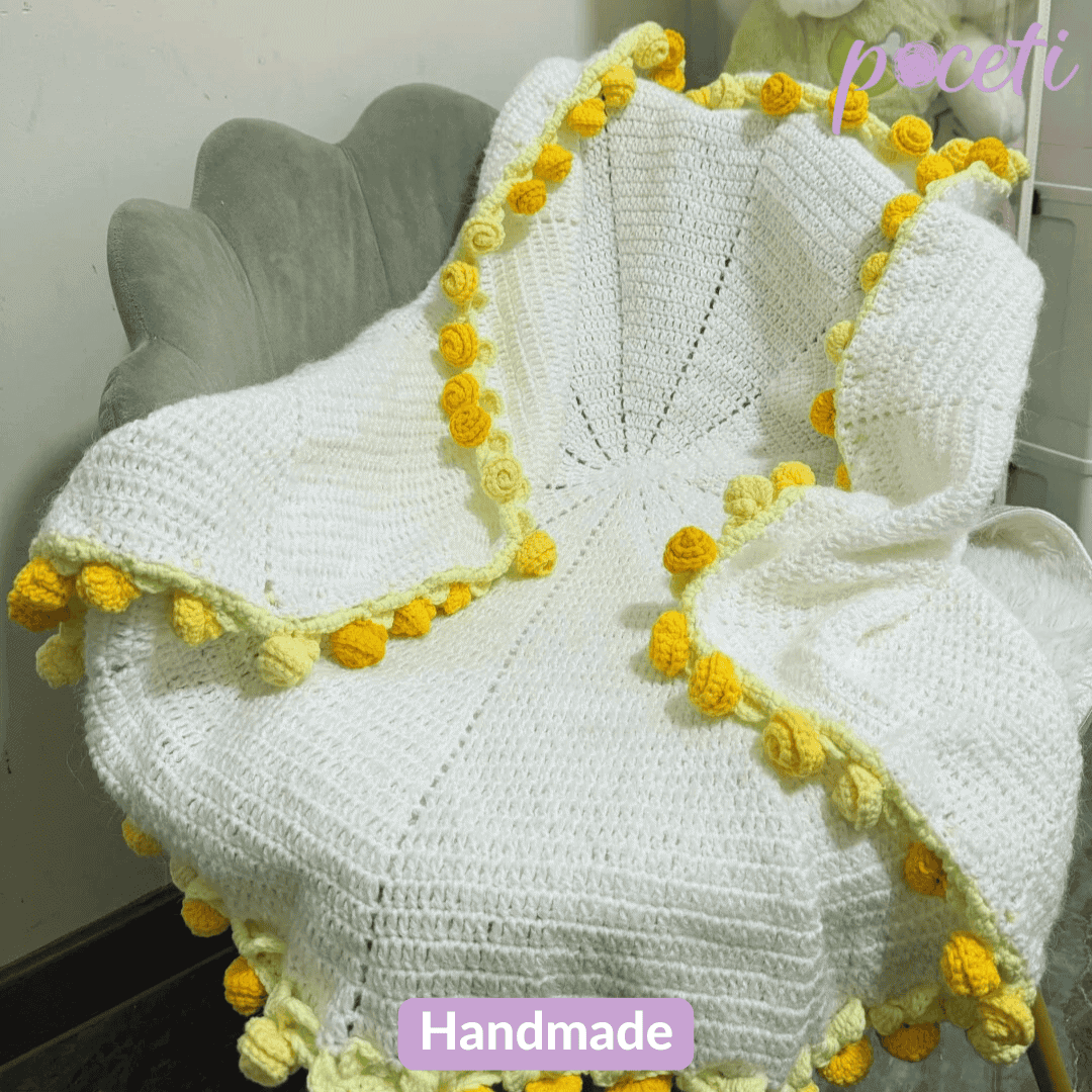 Handmade daisy crochet flower bouquet blanket with soft floral patterns and cozy pastel tones